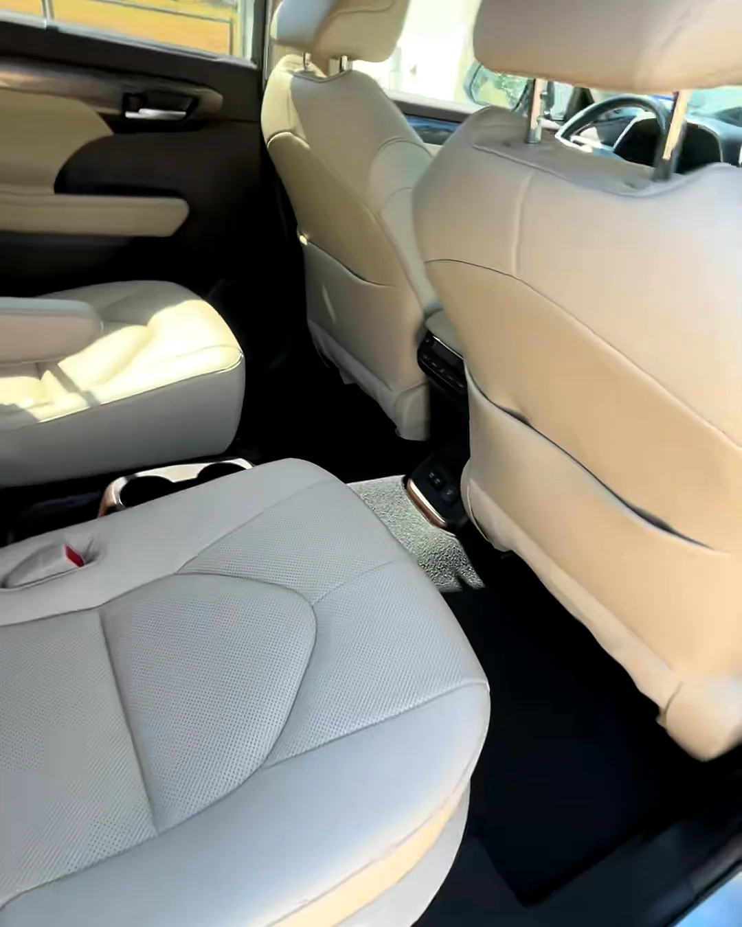 The Highlander's cream second-row seats after cleaning