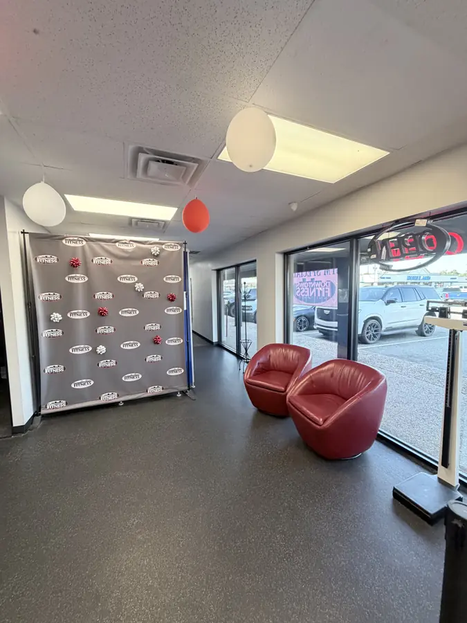 The entry, red chairs and balloons by the door