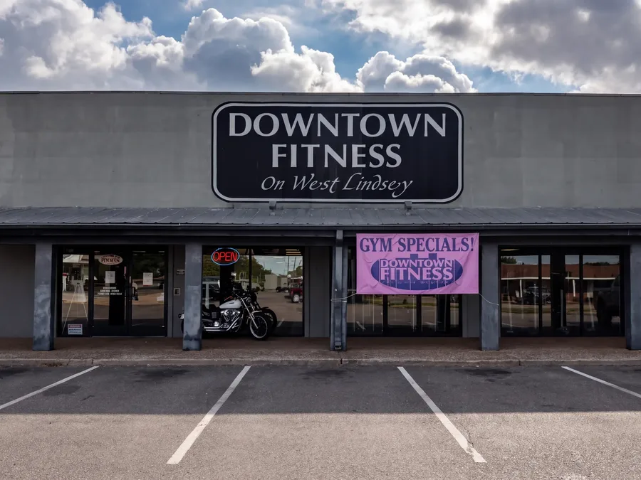 The Downtown Fitness on West Lindsey storefront and the parking lot out front