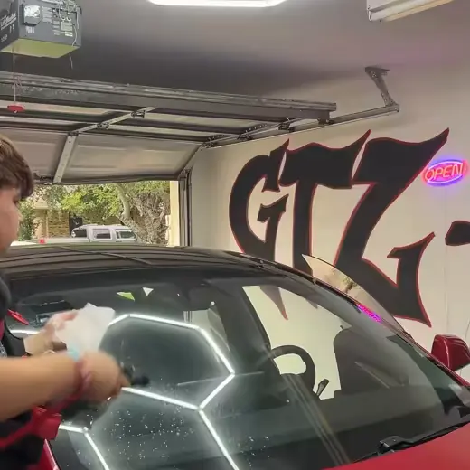 Tinting the windshield of a red Tesla Model 3