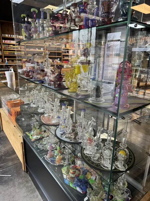 Glass tower case of colored rigs and recyclers