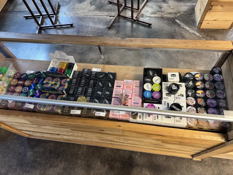 Grinders and boxed accessories in a display case