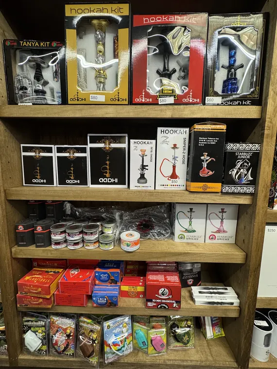 Boxed hookah kits and shisha on shelves